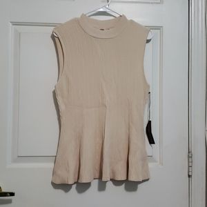 Eva Mendes beige peplum top